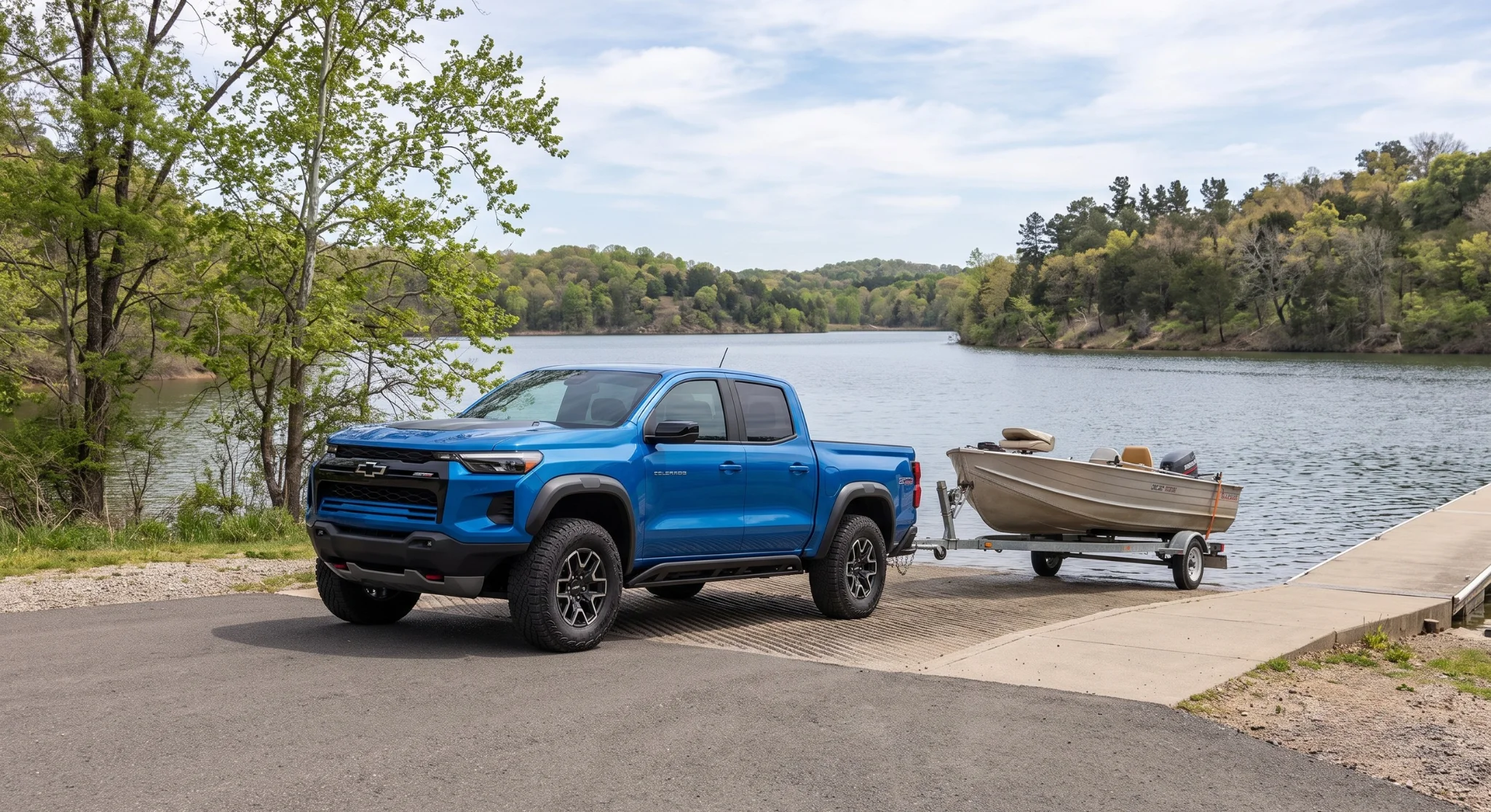 2026 Chevrolet Colorado towing a trailer on the highway