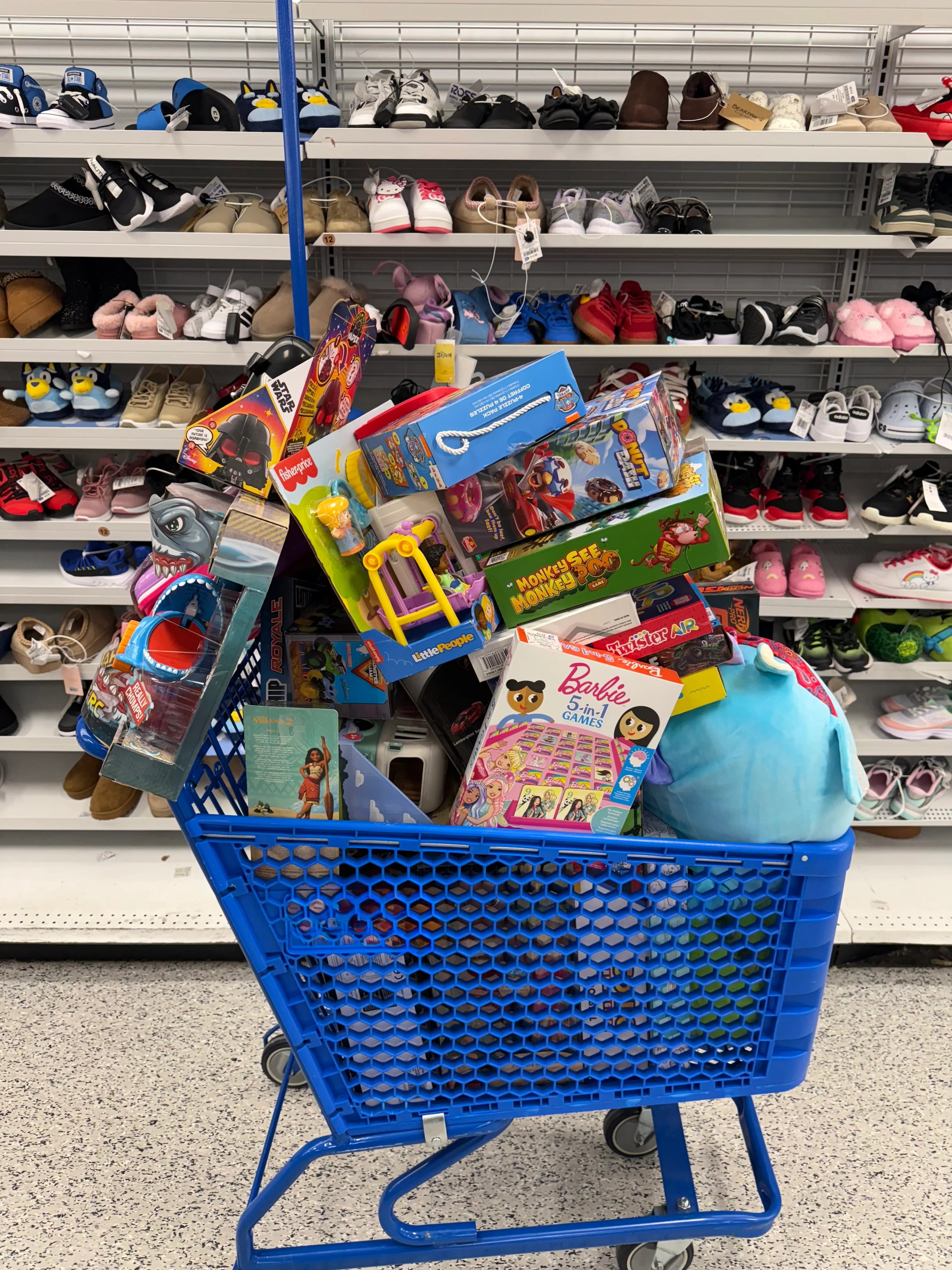 Toys for Tots collection box and donated gifts at Galleria Chevrolet