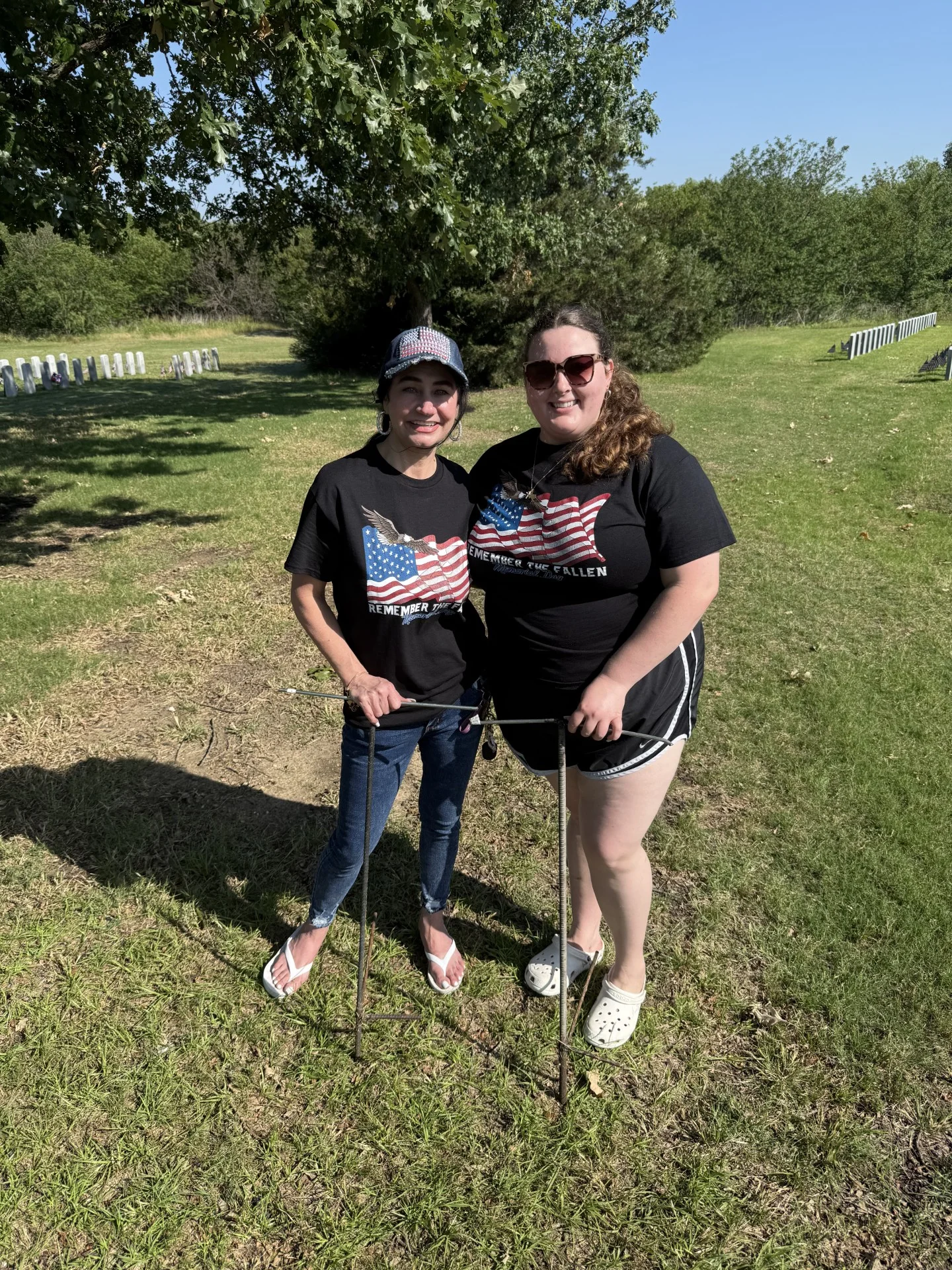 American flags placed at veterans' grave markers at DFW National Cemetery for Memorial Day