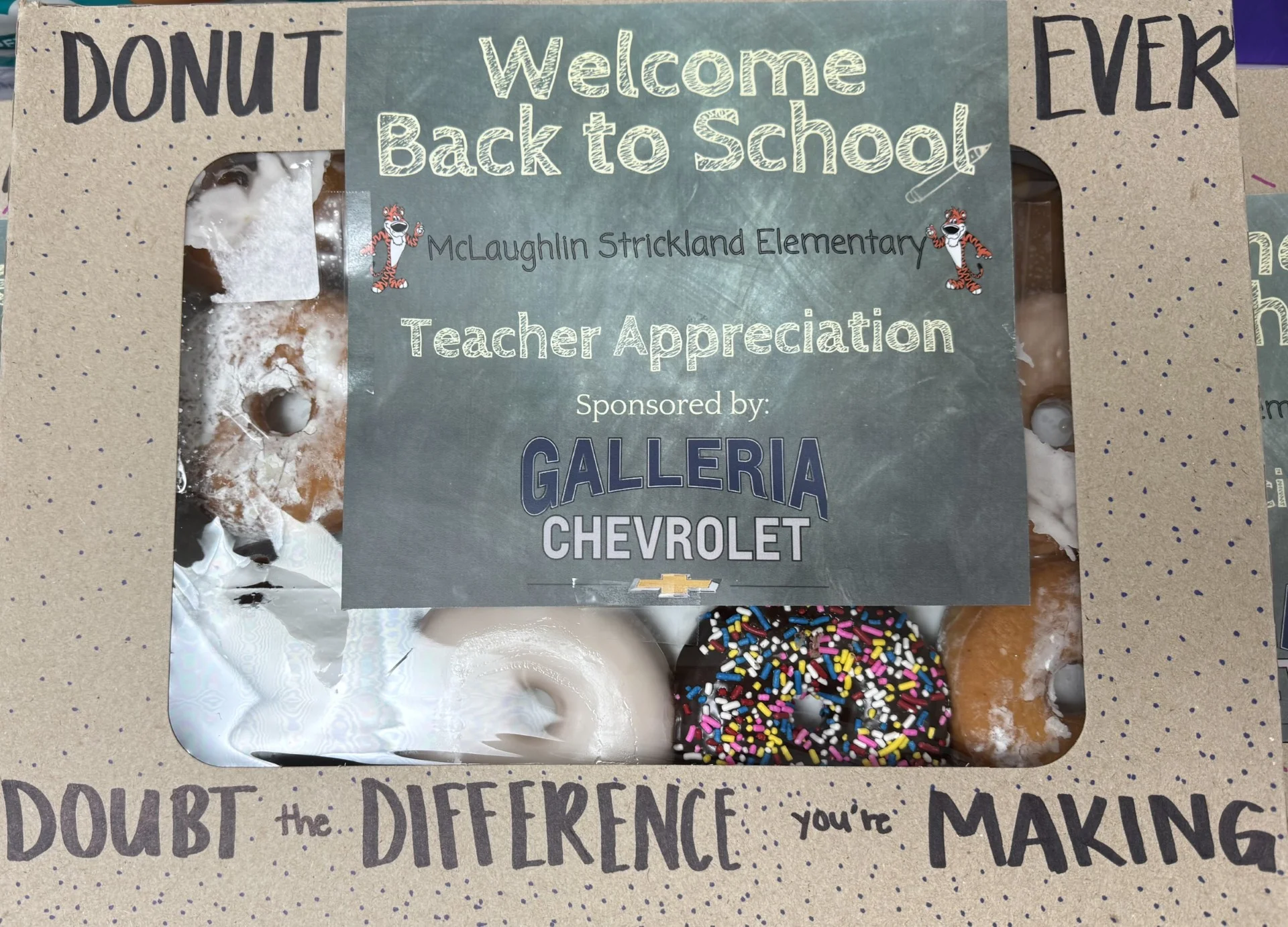 Teachers and staff at McLaughlin Strickland Elementary with coffee and donuts from Galleria Chevrolet