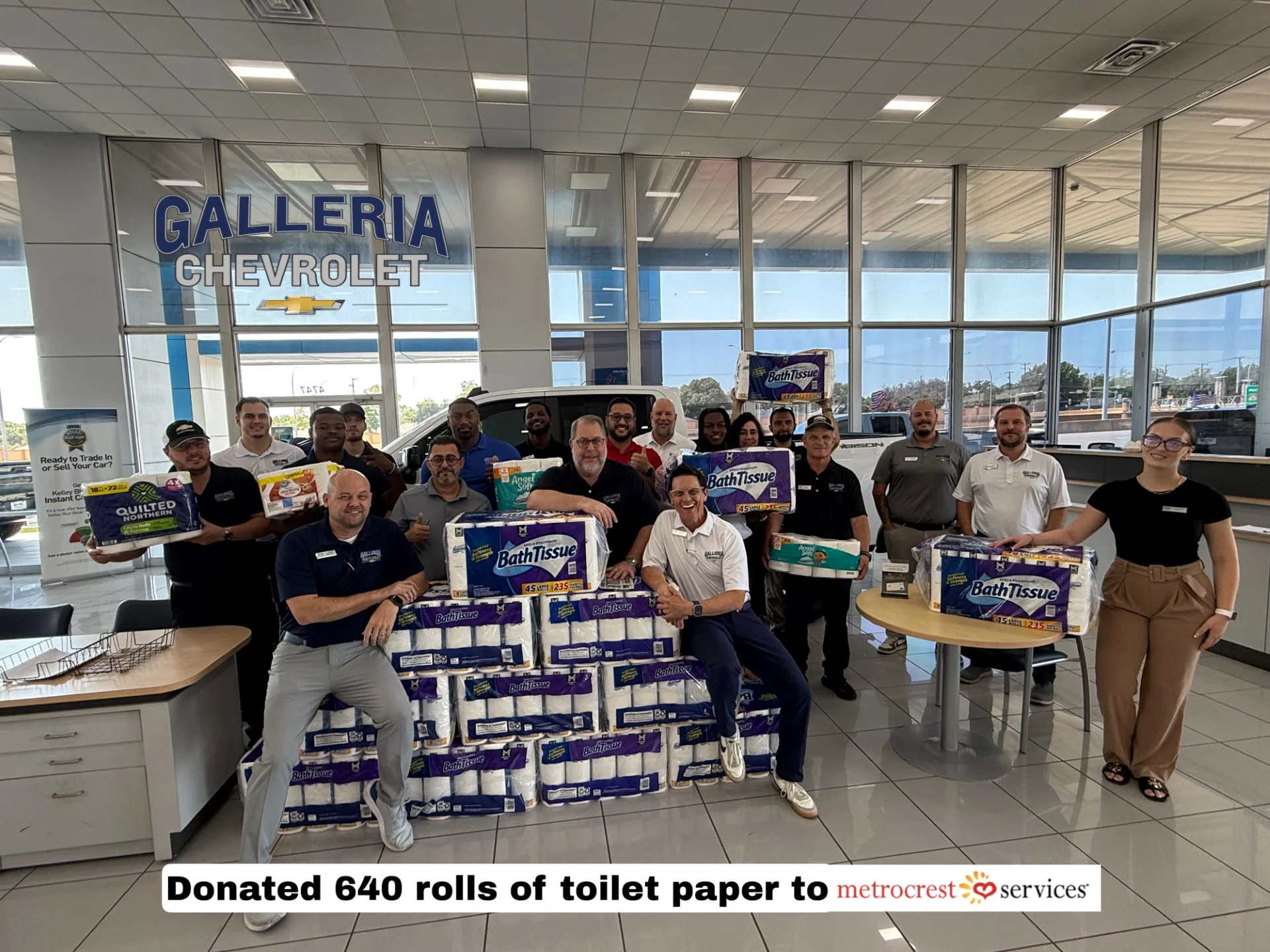 Galleria Chevrolet team with Metrocrest Services staff at the toilet paper drive