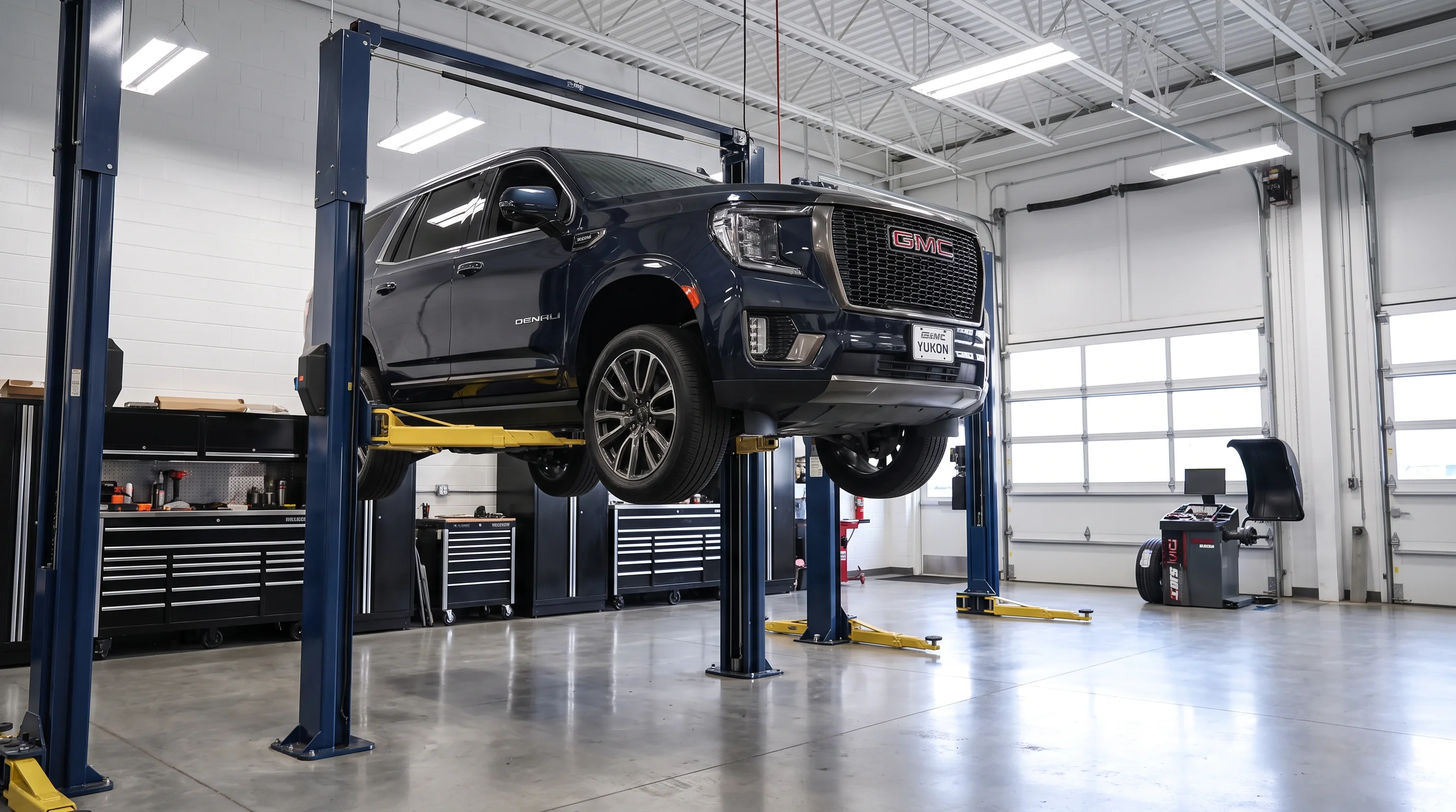 Certified GMC technician performing a fall maintenance inspection at Legacy GMC of Waxahachie in Waxahachie, TX