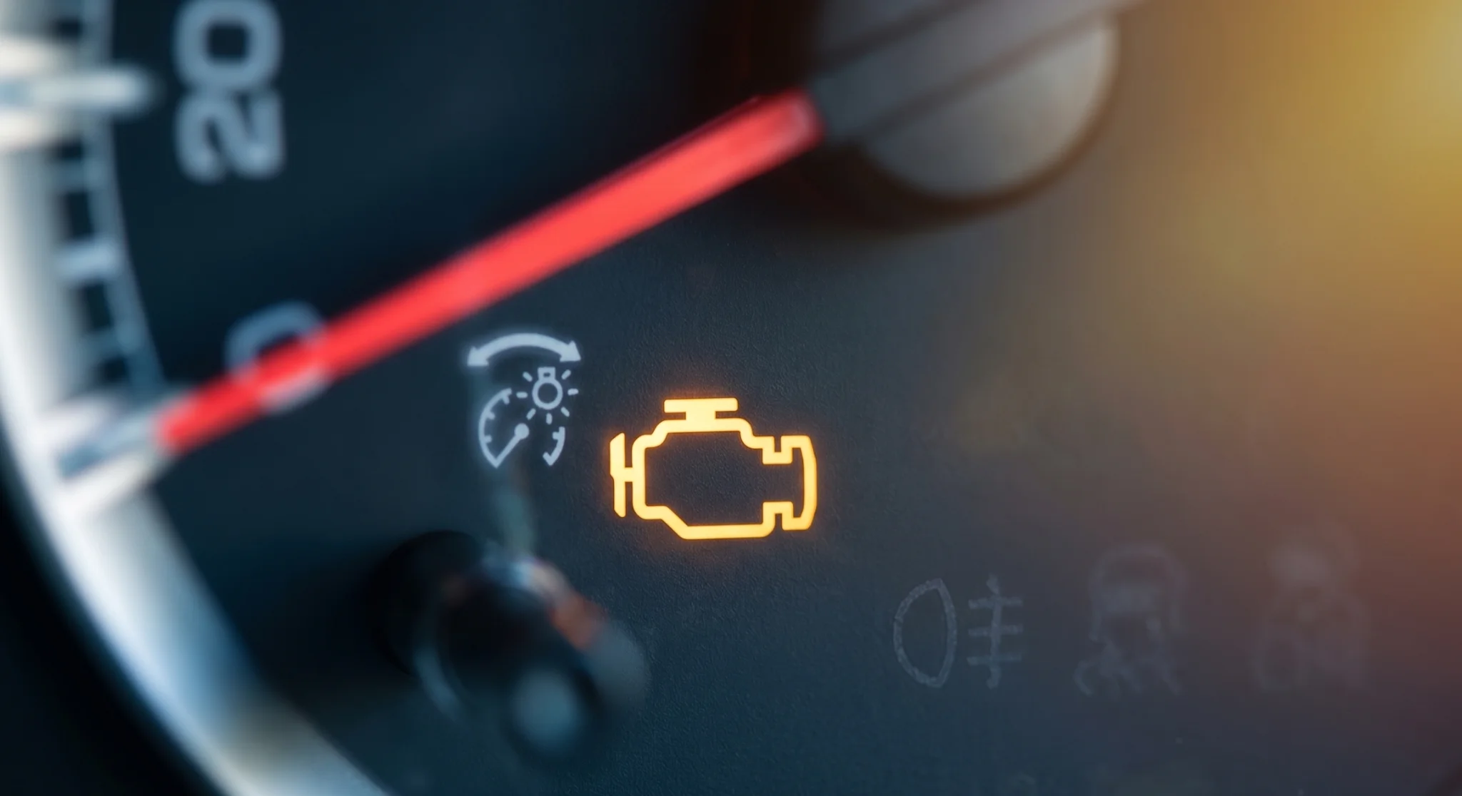 Illuminated Toyota check engine light warning symbol on a vehicle dashboard
