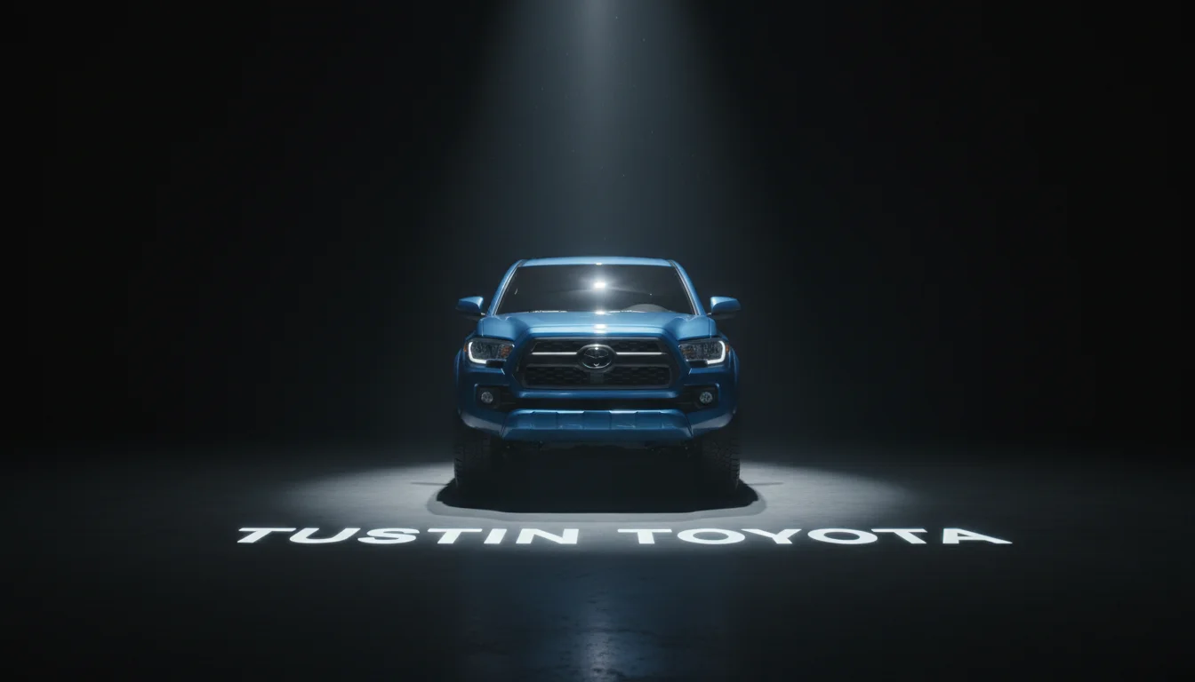 2026 Toyota Tacoma pickup truck in spotlight at Tustin Toyota dealership showroom in Tustin, CA